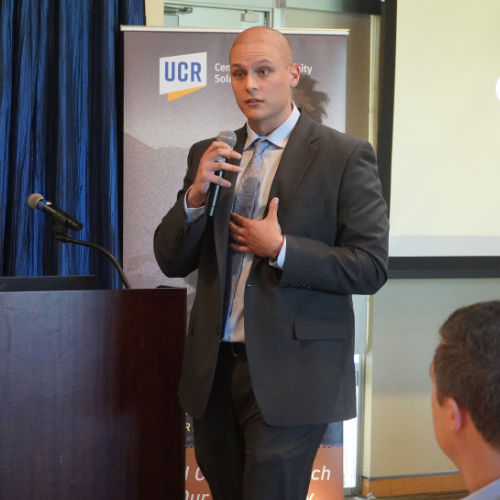 A male student giving a presentation.