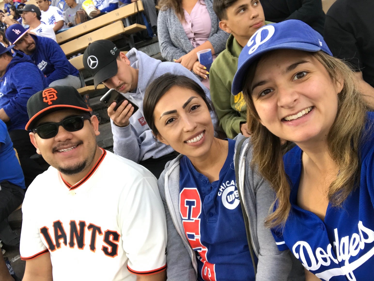 Esau, Ana Yeli, and Mikaila at a baseball game