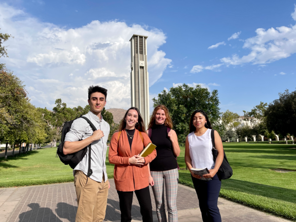 Public policy students posing in front of the UCR bell tower